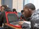 student working with laptop in classroom